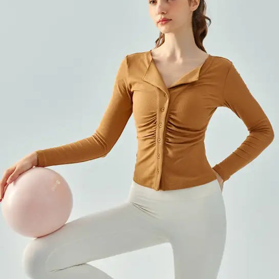 Woman wearing Wild Rose Yoga Tee in Milk Tea White with breathable fit and white leggings