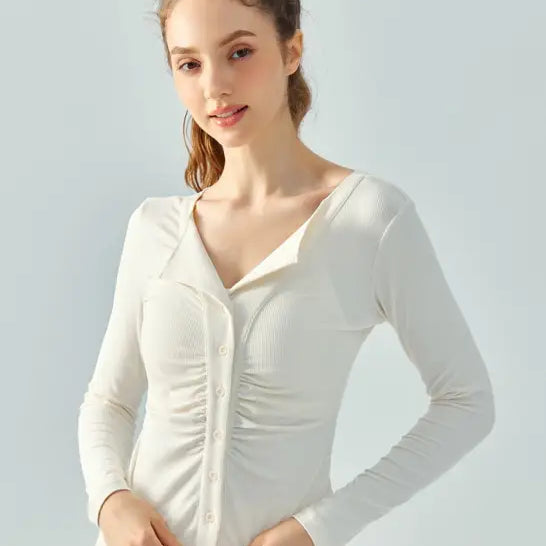 Woman wearing Wild Rose Yoga Tee in Milk Tea White with long sleeves and breathable fit