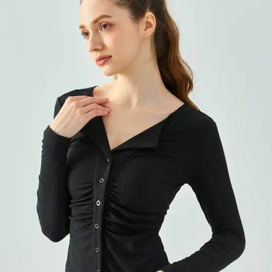 Woman wearing black button-up long-sleeve shirt from Wild Rose Yoga Tee in Milk Tea White