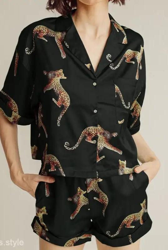 Black leopard print pajama set from Wild Tiger Pajamas, featuring short sleeves and shorts