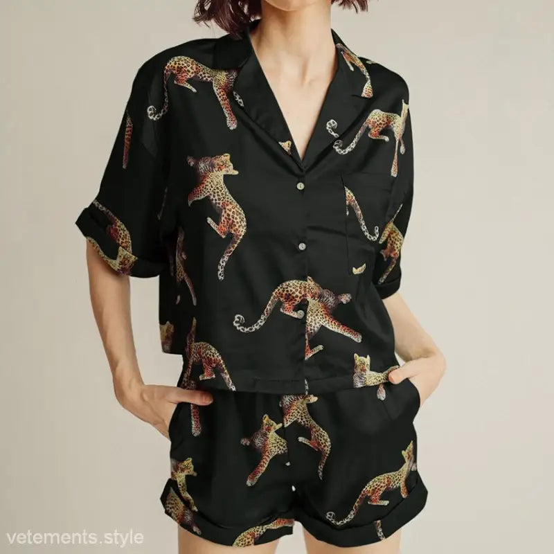 Black leopard print pajama set from Wild Tiger Pajamas, featuring short sleeves and shorts