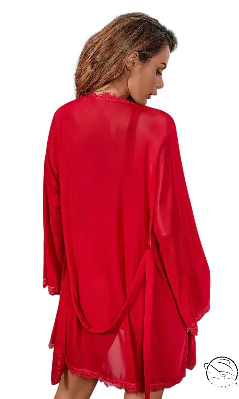 Vibrant wine red outerwear gown with sheer chiffon, lace trim, and belted twisted sleeves