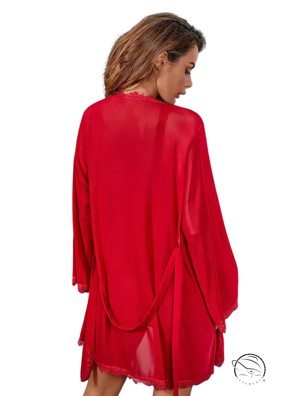 Vibrant wine red outerwear gown with sheer chiffon, lace trim, and belted twisted sleeves