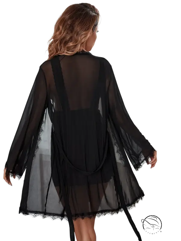 Black sheer lace-trimmed outerwear gown with belted sleeves