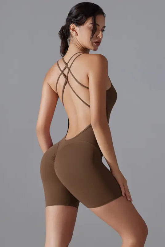 Brown bodysuit with criss-cross back straps and short legs.