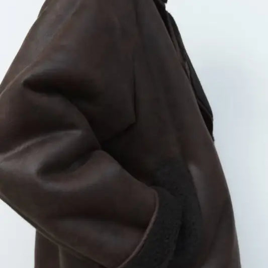 Brown faux shearling jacket with dark collar and oversized sleeves for winter women clothing
