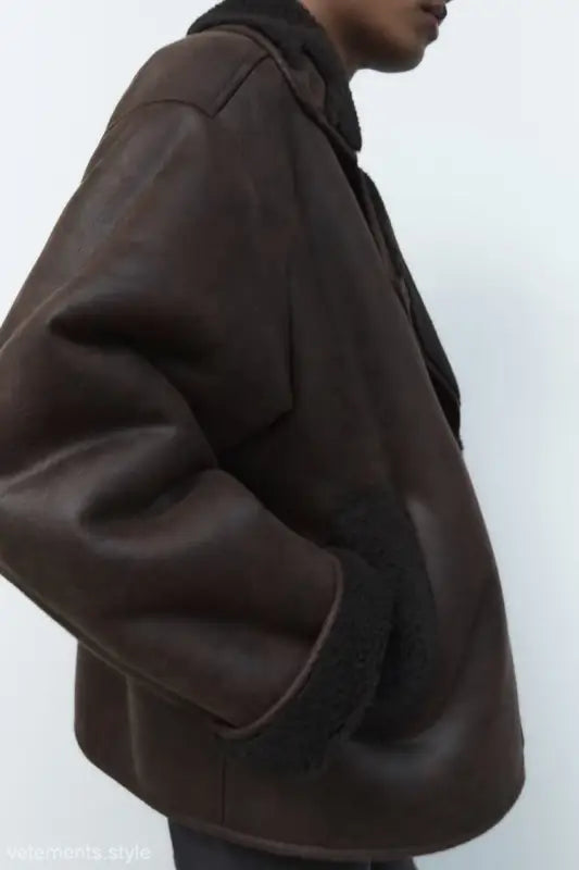 Brown faux shearling jacket with dark collar and oversized sleeves for winter women clothing