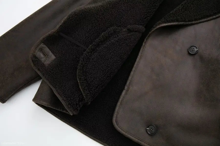 Dark brown faux shearling jacket with black fleece lining and button closures for winter women clothing