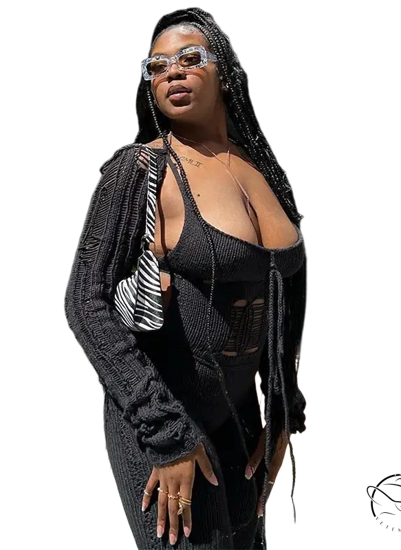 Black knitted cardigan with woolen cutout jumpsuit and tassels