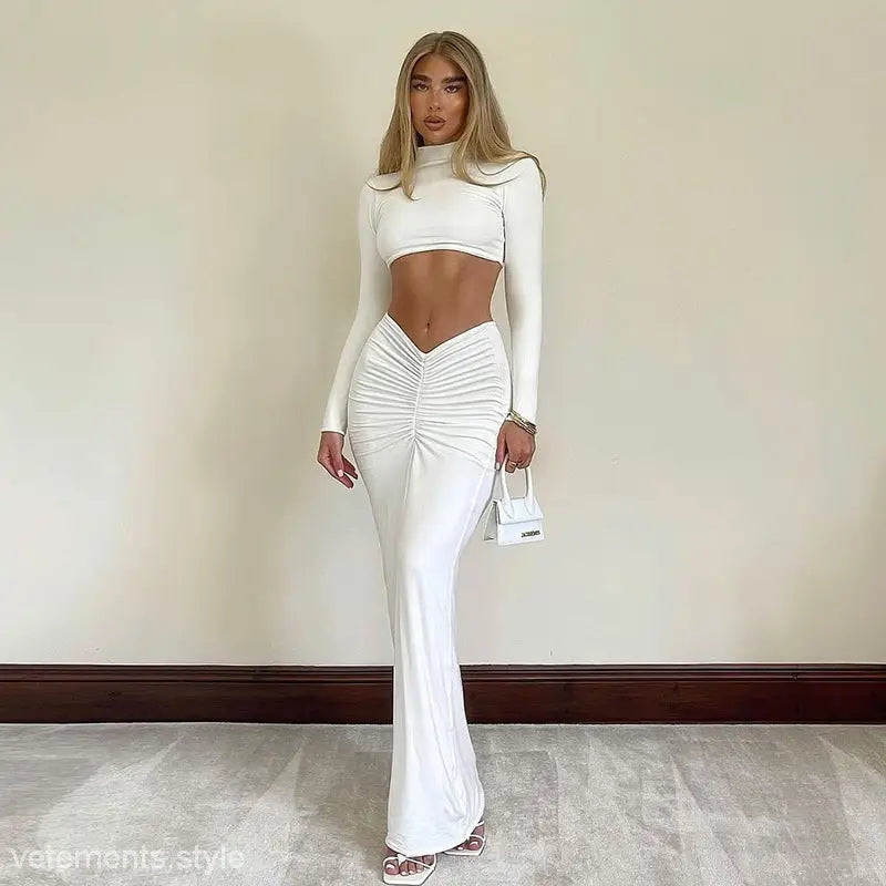 Woman in white crop top and maxi skirt from Yara Summer Long Sleeve Ruched Set