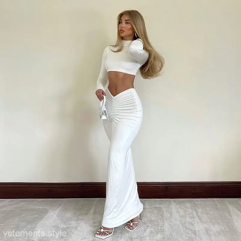 Woman in white crop top and skirt from Yara sexy summer long sleeve set
