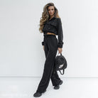 Woman in black cropped hoodie and wide-leg pants showcasing Elegant Vetements Suit