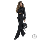 Woman in elegant Vetements suit with long sleeve cropped hoodie and wide-leg pants