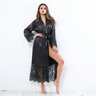 Black satin long sleeve nightgown with lace cutouts and tie waist