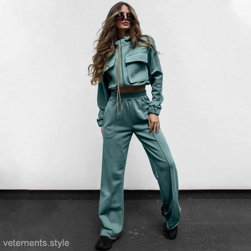 Woman in a teal tracksuit showcasing the Elegant Vetements Suit with long sleeves