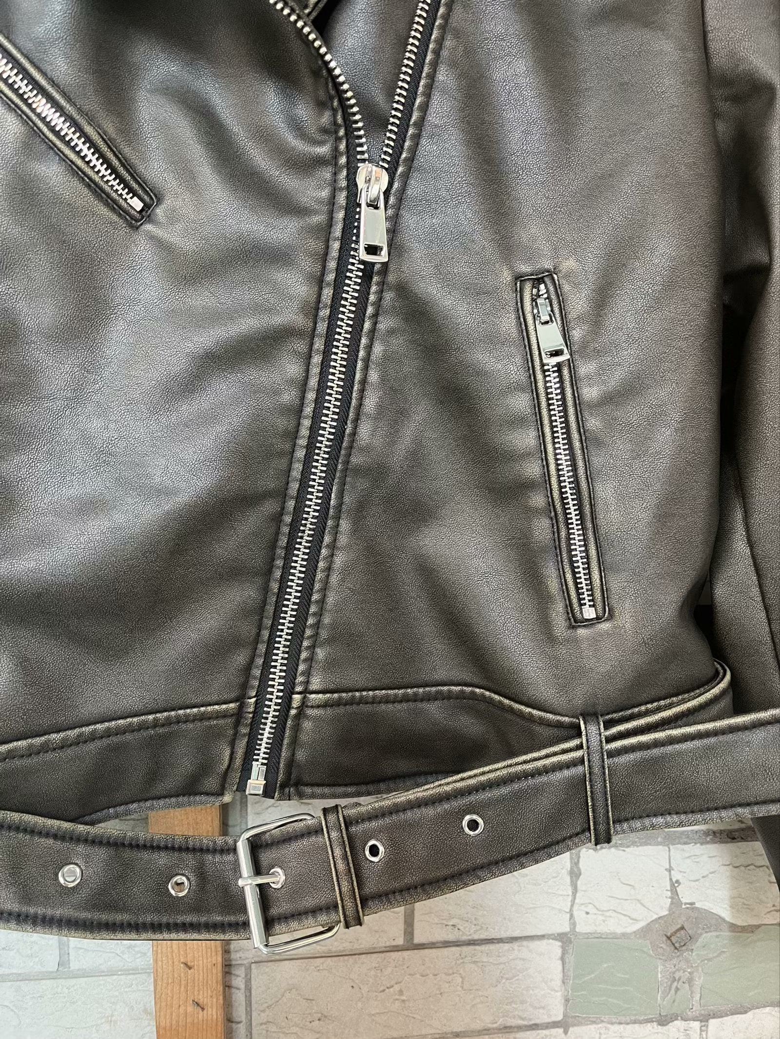Beautiful warm Langry leather jacket with silver zippers and belt