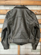 Beautiful warm brown leather jacket with black stitching and zipper details