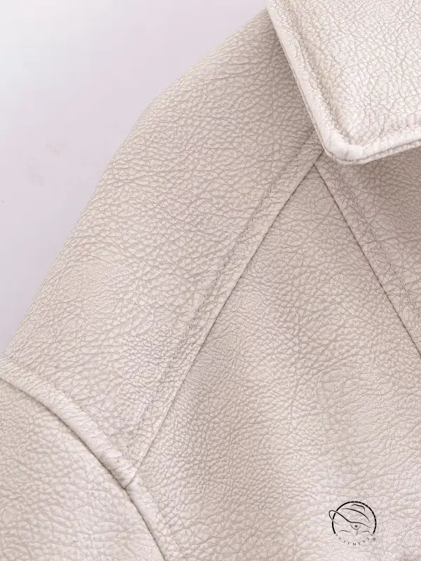 Retro faux leather jacket with cream textured surface and notched lapels