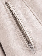 Silver zipper on retro washed faux leather jacket