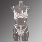 Floral-embroidered lingerie set on mannequin showcasing elegant fashion and ملابس style