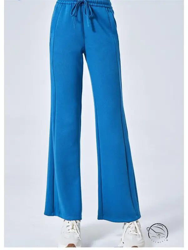 Blue summer air layer drawstring sweatpants with white sneakers