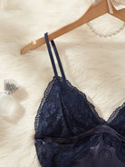 Navy blue lace artificial silk camisole lingerie with satin trim and floral patterns