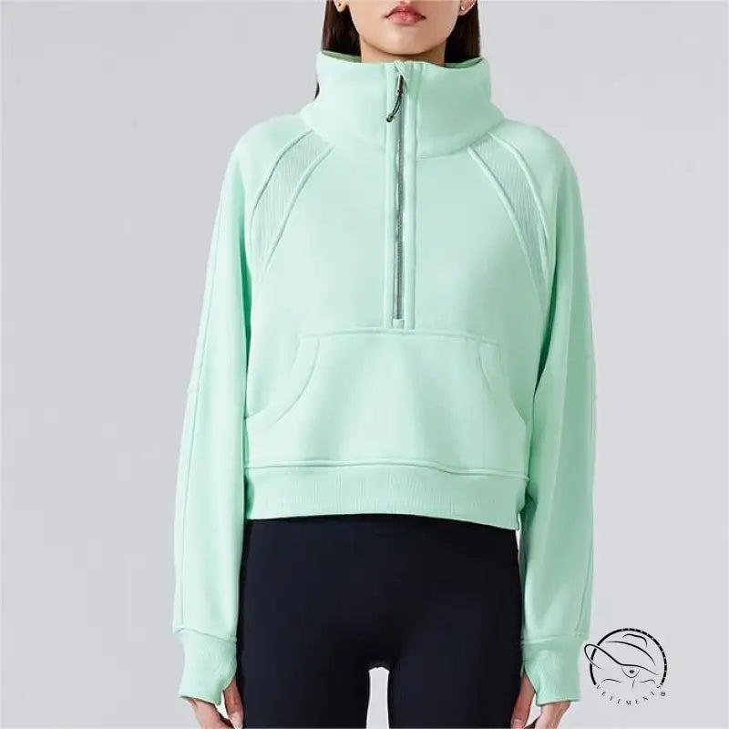 Mint green half-zip sweatshirt with high stand collar