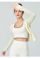 Woman in athletic wear showcasing Langry Sports Long Sleeved Jacket for workout fashion ملابس