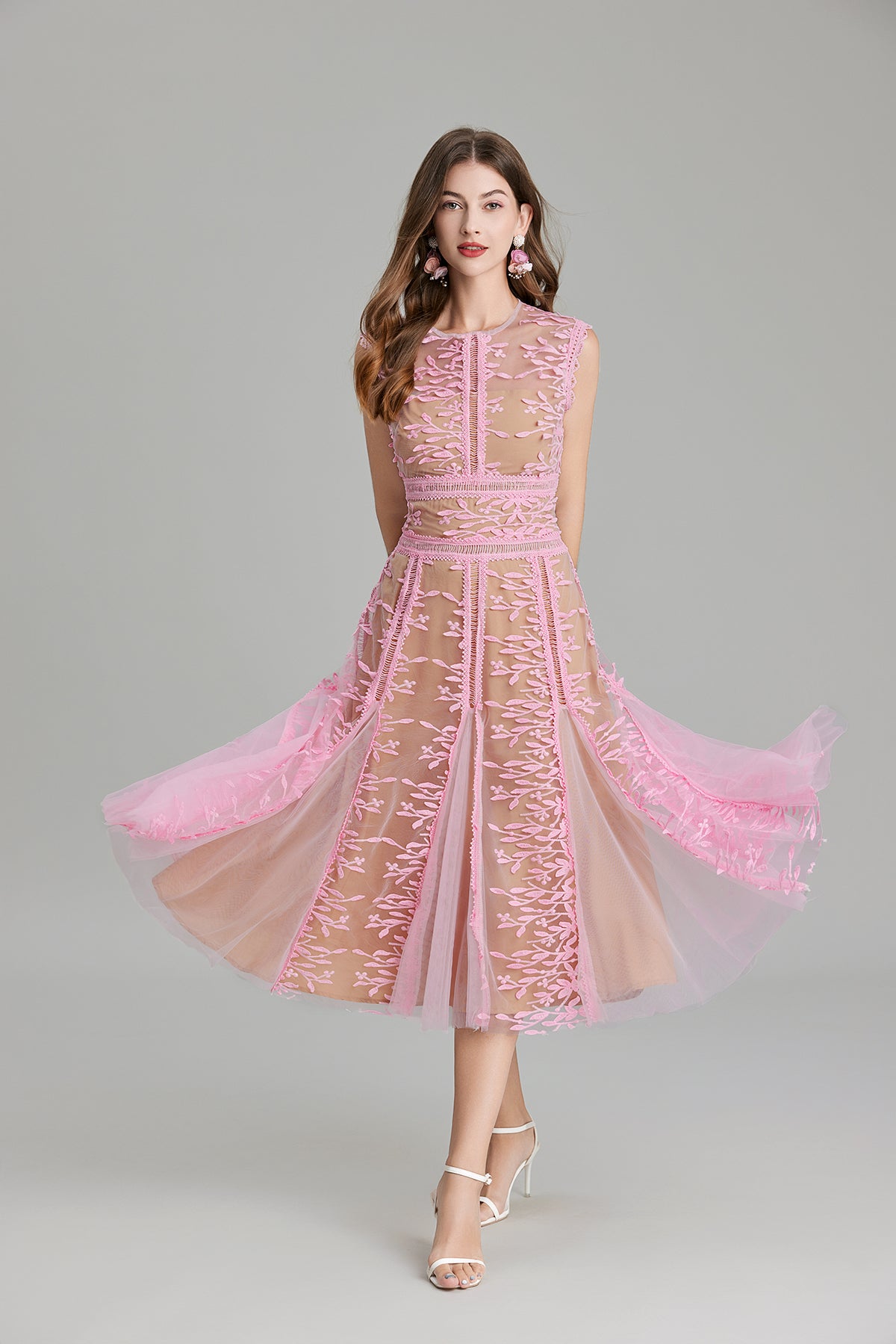 Pink lace midi dress featuring embroidered three dimensional mesh and intricate stitching