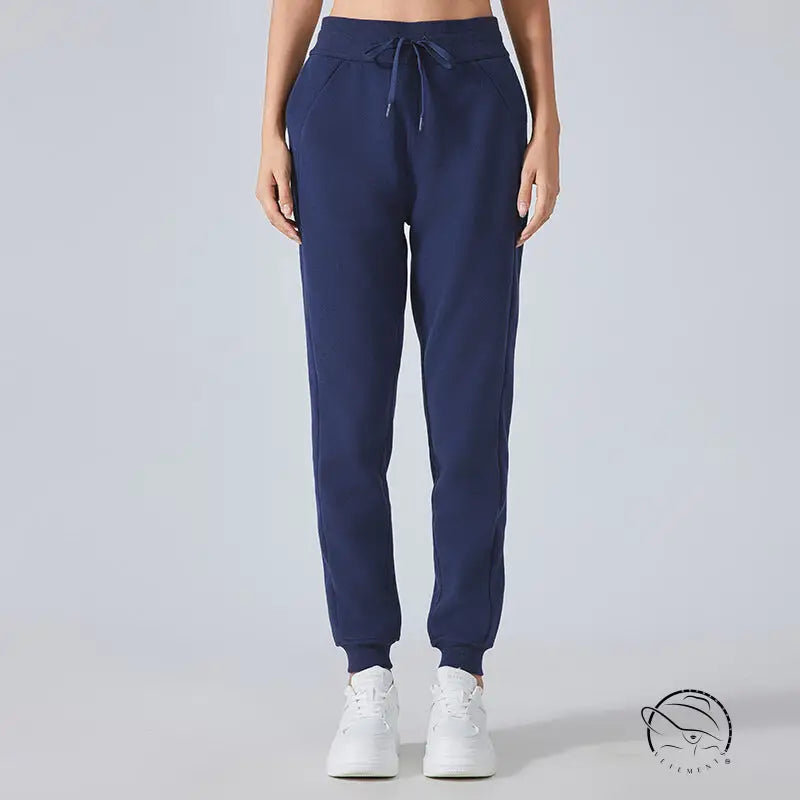 Navy blue casual loose tapered sports pants with elastic cuffs
