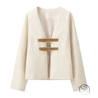 Elegant langry cream cropped blazer with gold buckle details, fashion coat
