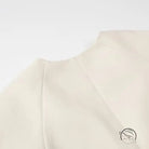 Elegant langry fashion cream sweater with metal buckle, high neck, long sleeves