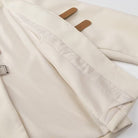 Langry fashion cream canvas tote with leather handles and metal buckle