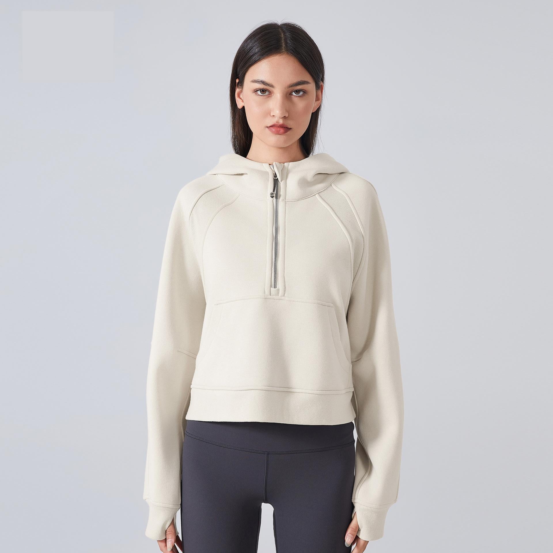 Woman’s beige half-zip hoodie for outdoor fitness and cozy autumn winter fashion
