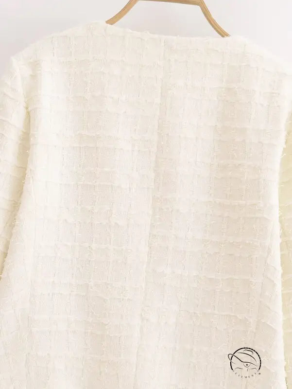 White textured grid sweater on wooden hanger, Langry winter woolen fashion coat