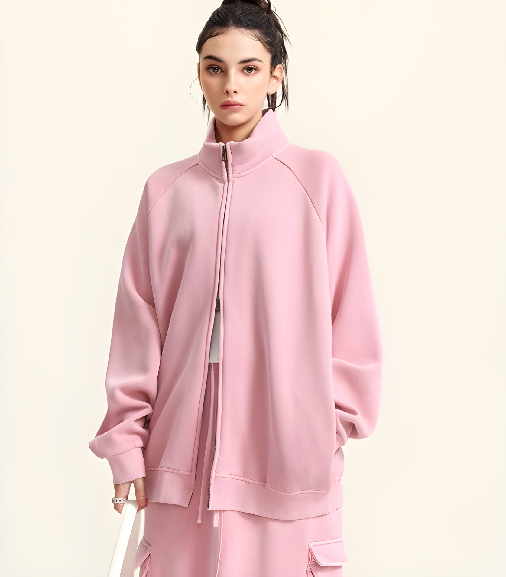 Pink zip-up sweatshirt with raglan sleeves, ideal for stylish winter fashion ملابس