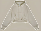 Beige cropped zip-up hoodie with pocket, perfect for trendy winter fashion ملابس