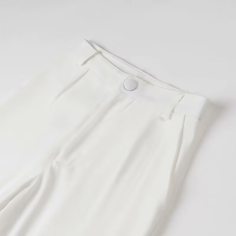 Elegant white linen pants with button pocket detail in Langry fashion suit
