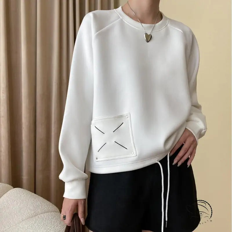White langry casual embroidery sweatshirt with black x patch and silver buttons