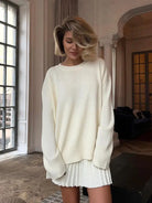 Woman in cute knitted skirt set with oversized white sweater