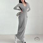 Long grey knit fashion dress with V-neck, long sleeves, and white sneakers