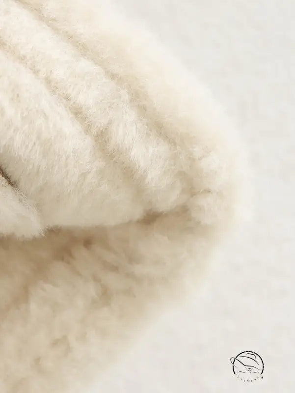 Cream-colored fluffy faux fur scarf on Langry winter fashion suede coat