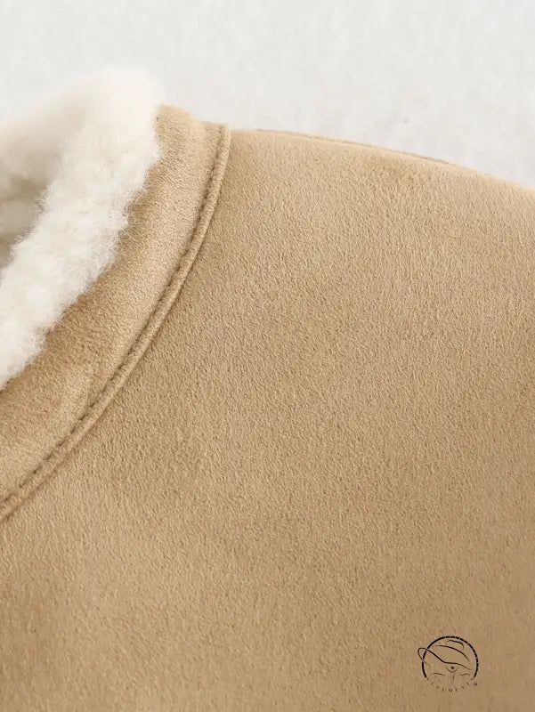 Beige shearling-lined langry fashion bootie with fur trim for winter street style
