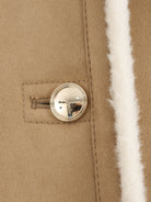 Winter fashion beige suede coat with silver buttons and white fur trim