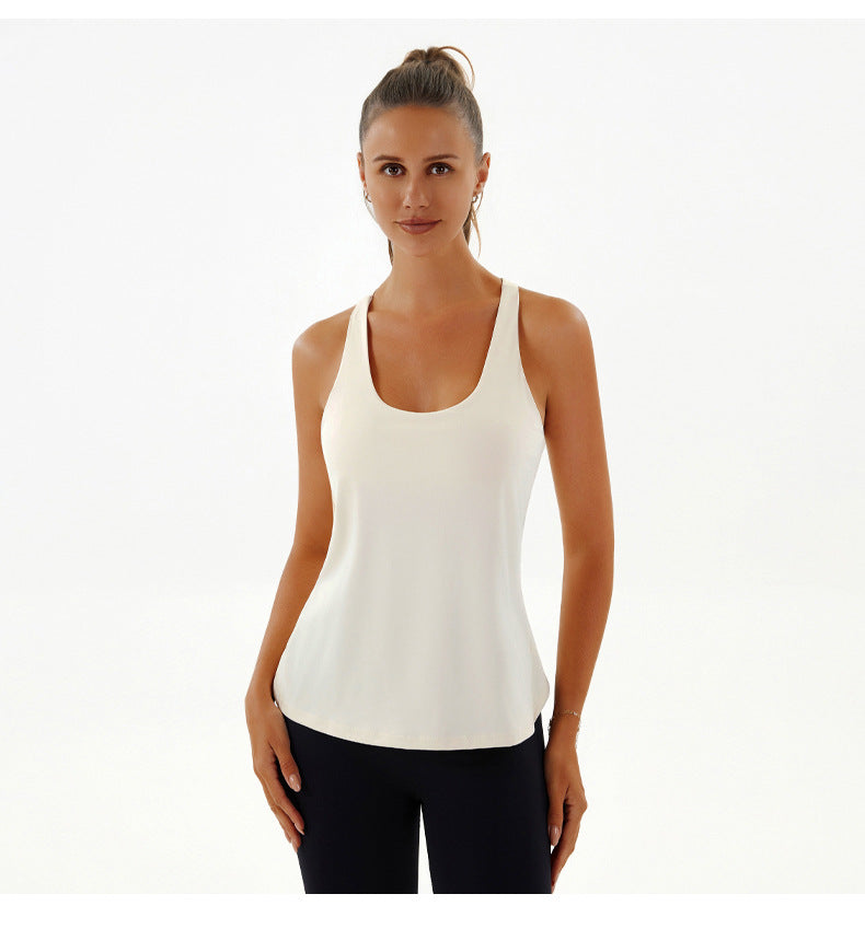 Woman in a white tank top showcasing Yoga Breathable Top, perfect for fashion and ملابس