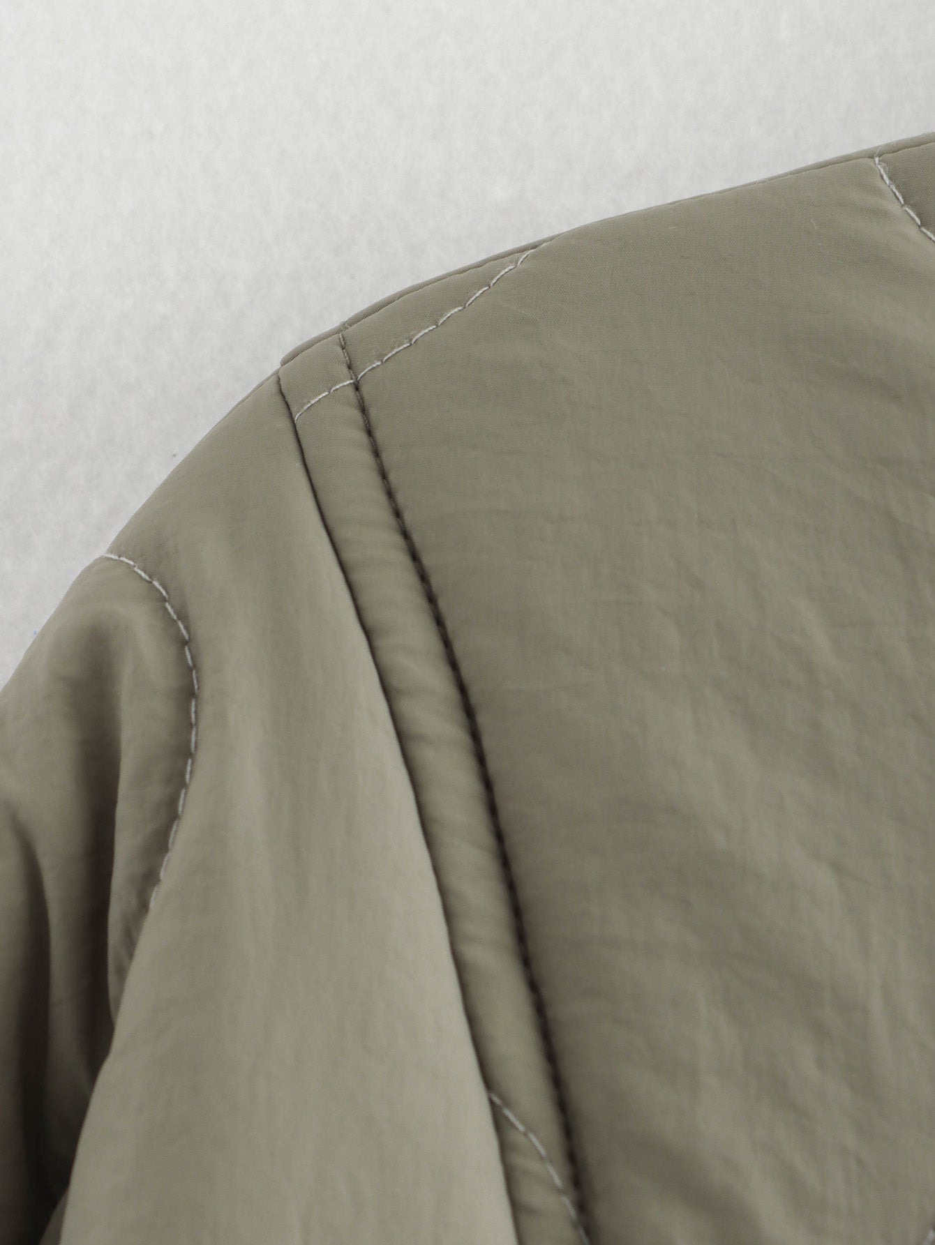 Olive green quilted jacket detail of All Match Leopard Print Cotton Coat in fashion ملابس