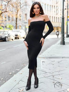 Elegant woman in black off-shoulder langry fashion knitted dress