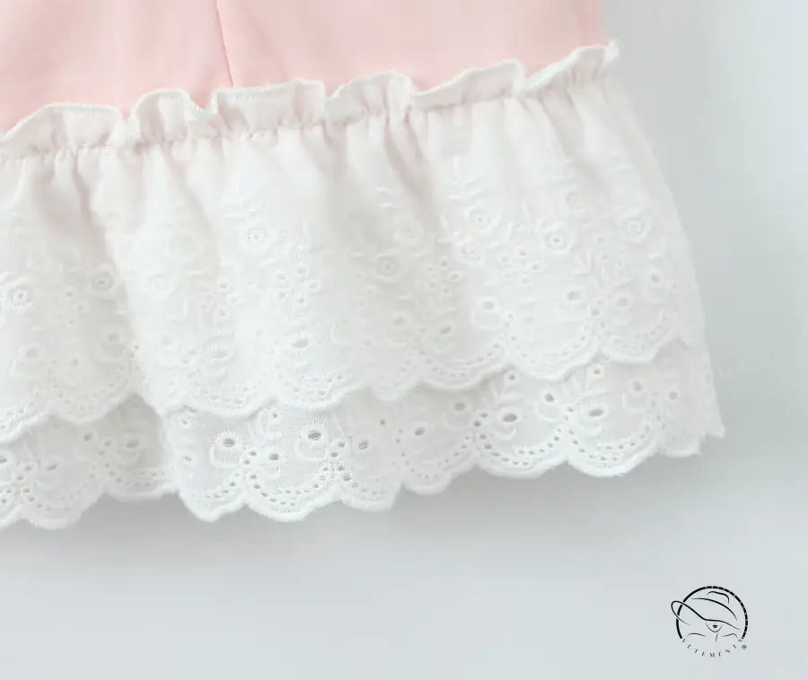Delicate white eyelet lace trim on enchanting steel bracket short dress