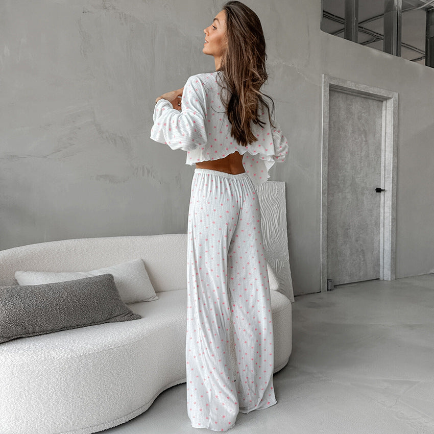 Women’s white two-piece pajamas with pink polka dots featuring knitted heart printing