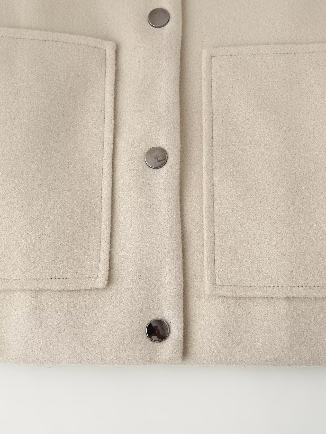 Cream-colored minimalist single breasted Langry fashion jacket coat with pocket details